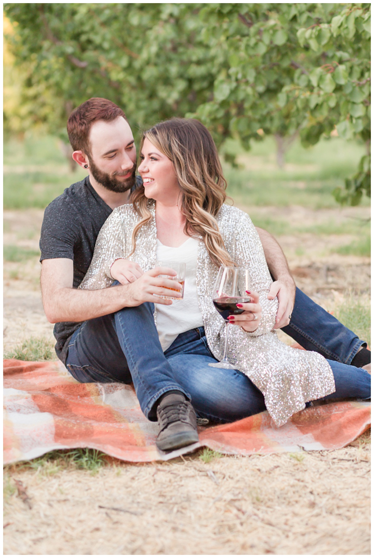 Couple drinking wine on the blanket