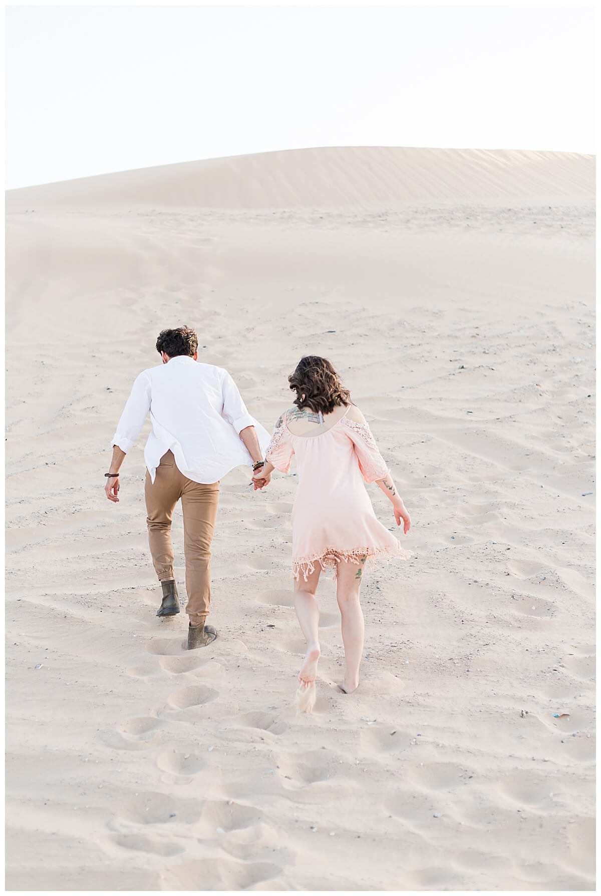 Couple walking at the Nellis Sand Dunes
