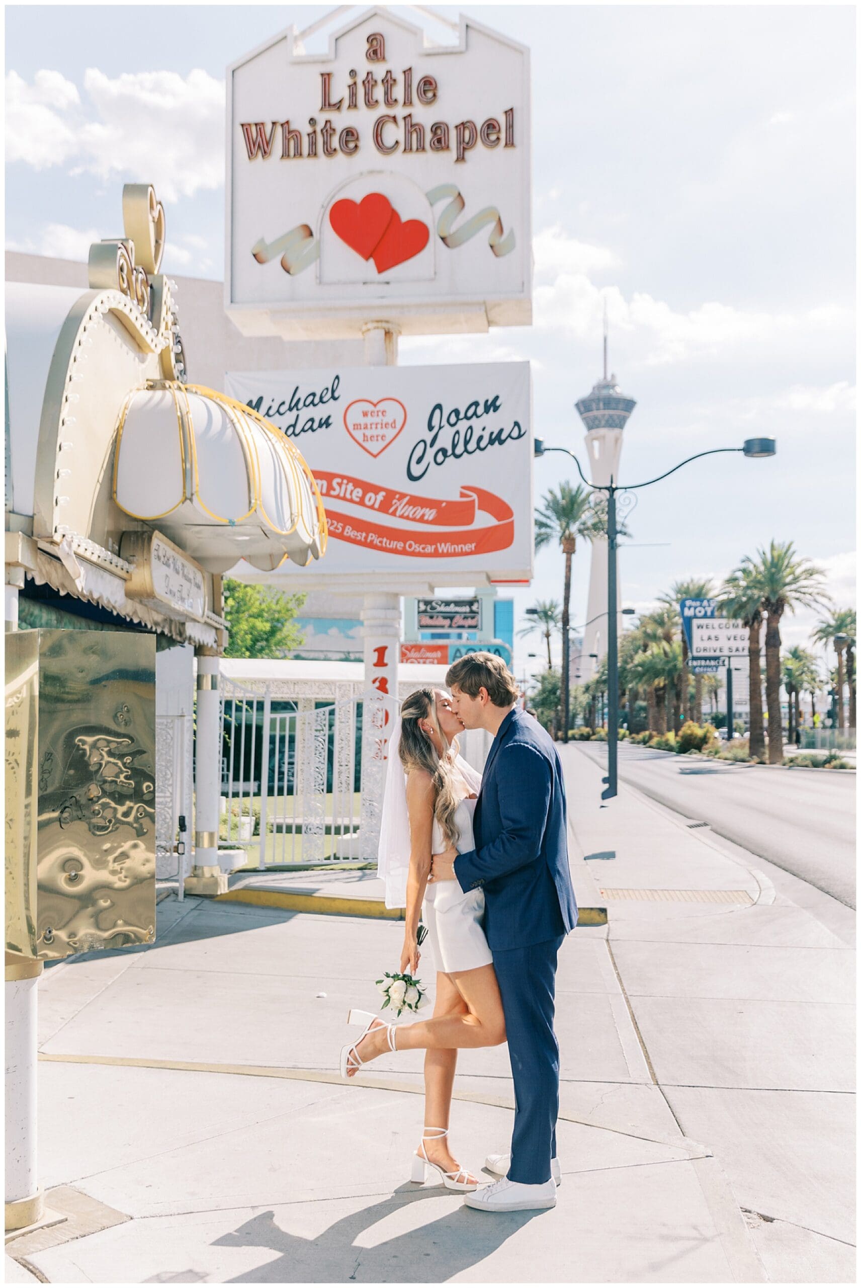 couple kissing at little white chapel